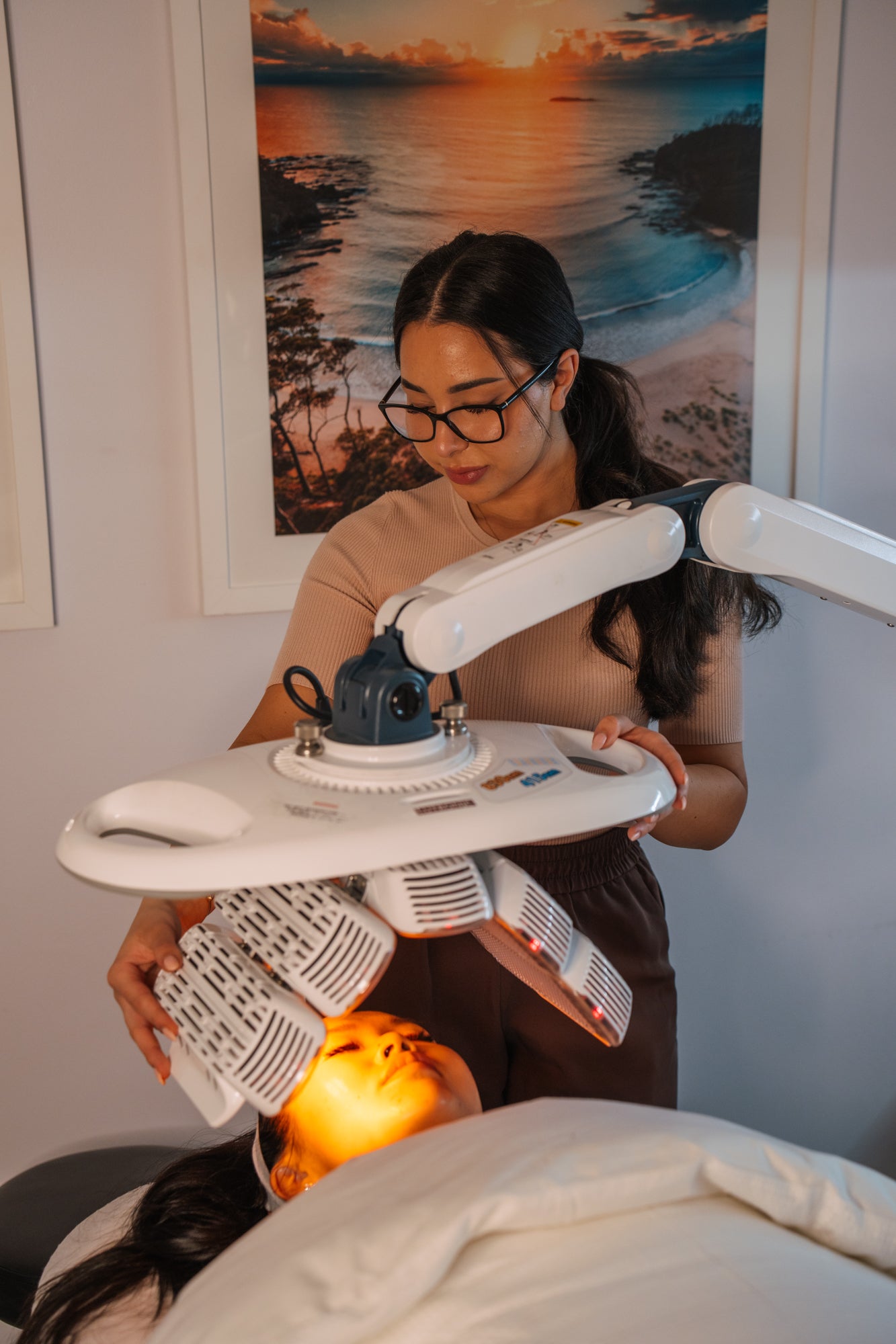 Woman receiving LED light therapy at Sydney's Ilumaé Skin Bar